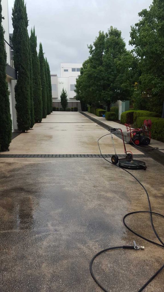 Driveway during high pressure cleaning